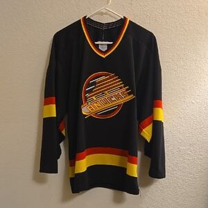 NHL Vancouver Canucks Black Hockey Jersey with Red and Yellow Stripes - Medium